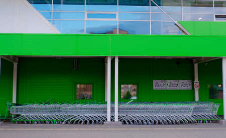 parking for shopping baskets. shopping in the supermarket. parked baskets.empty parking lot. Shopping Baskets for Products in supermarketの写真素材