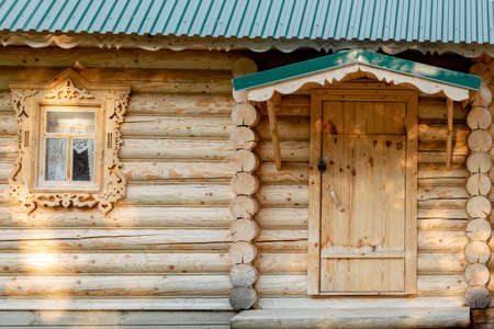 russian wooden house. traditions of Russia. Wooden windows. Log house.の写真素材