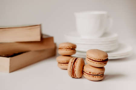 pasta in a coffee cup. caramelized macaroons. Light tortillas with dessert. Pasta on a white plate...
