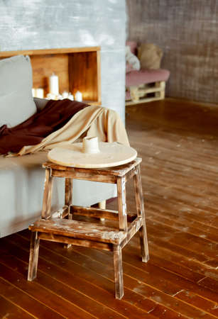 Potter's wheel. Clay modeling workshop. loft studio for modeling. Brown interior.の写真素材