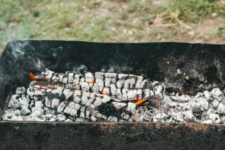 Close-up of burning charcoal. black coals on the grill