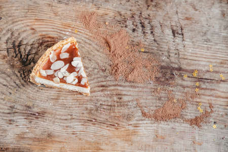 piece of caramel cheesecake on a wooden background, top view. Cheesecake new york, copy space