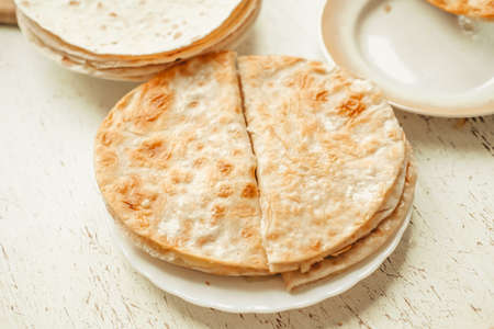 flatbread with potatoes, On a white wooden table. traditional muslim dishの写真素材