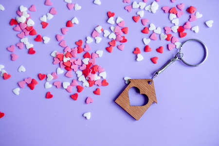 Valentine's day concept many small hearts and keychain on purple backgroundの写真素材