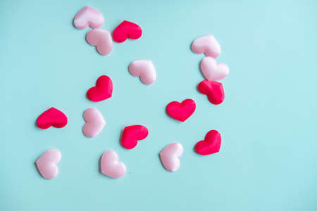 Valentine's Day background. White and red hearts on pastel blue background, top view, copy space. Valentines day concept.の写真素材