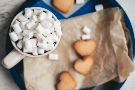 coffee with marshmallows and heart cookies on a round tray. Date on valentine's day. Nice and sweet set for Valentine's day.の写真素材