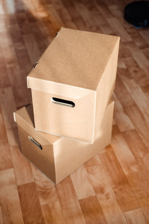 boxes on top of each other close-up on the floor. Moving theme with cardboard boxes