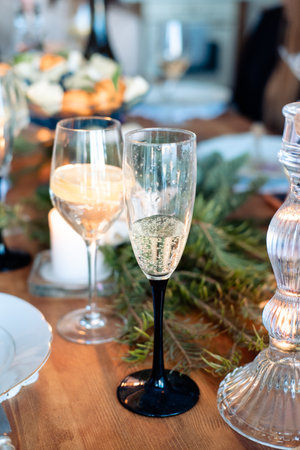 two glasses with alcohol on the New Year's table. glass of champagne and cocktail with lemon in a glassの写真素材