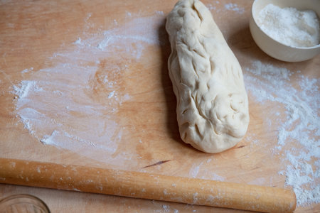 Working on an unfinished rolling pin test. Preparing pastries from doughの写真素材