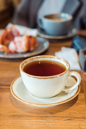 a cup of tea close-up in a cafe,vertical frameの写真素材