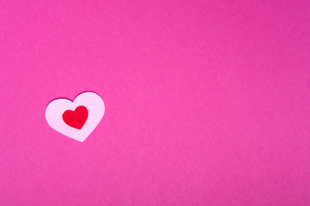 heart on a pink background for a greeting card or banner for Valentine's Day, copy spaceの写真素材