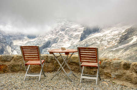homely seat to watch the glaciers and mountains. Mountain hut oberhab from la fouly in the val...