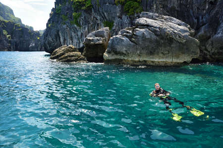 Diver at El Nido Palawan Paradise in the Philippines, Island hopping, dive spot, beautiful beaches ,cliffs, natureの写真素材
