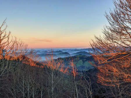 view of appenzell and toggenburg hill landscape in the zurich oberland. beautiful sunset with fog...