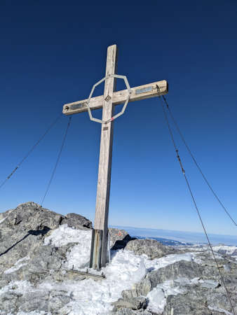 Summit cross on the Clariden summit. Ski touring in winter. The Clariden is a 3267m . Mountain of the Glarner Alps swissの写真素材