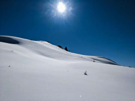winter landscape in a beautiful snowy mountain landscape in Switzerland on the mountain silberen