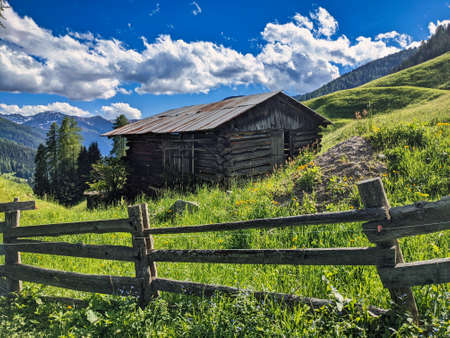 old wooden hut on an alp in switzerland. Swiss Alps. Old barn in a pasture. High quality photo. Tradition houseの写真素材