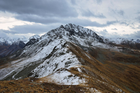 Rinerhorn Davos. Autumn hike to the Rinerhorn after the first snowfall in autumn. wanderlust. Cloudy...