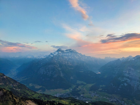 Evening mood on the Fronalpstock Glarus mountain peak. wanderlust. View of the Glarnisch Massif above Netstal. Quality photo. High quality photoの写真素材