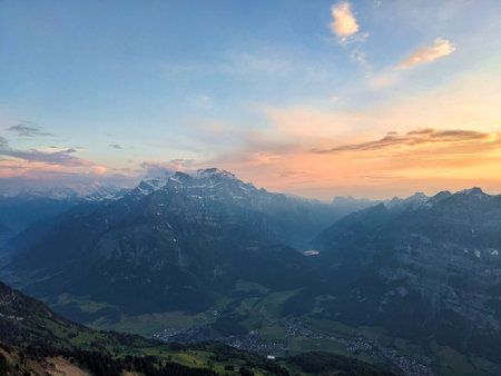 Evening mood on the Fronalpstock Glarus mountain peak. wanderlust. View of the Glarnisch Massif above Netstal. Quality photo. High quality photoの写真素材