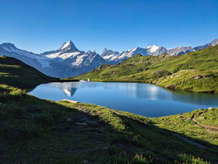Wonderful sunrise at the Bachsee above Grindelwald. Fantastic views of the mountains and glaciers. Fiescherhorn. Lake. High quality photoの写真素材