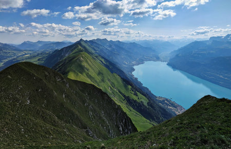 Hiking on the breathtaking Hardergrat in the Bernese Alps. Extremely dangerous path on the mountain ridge. High quality photoの写真素材