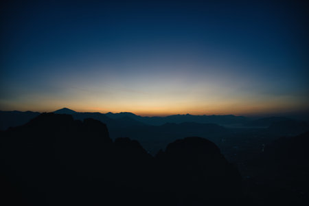 Majestic Sunrise Over Mountain Landscape in Golden Morning Light at Vang Vieng Laosの写真素材