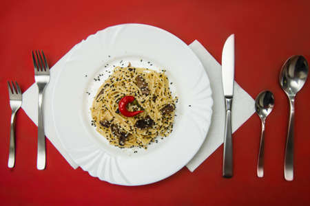 Italian pasta carbonara served in the restaurant on the tableの写真素材