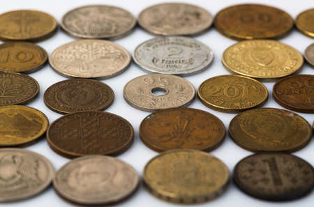 Closeup of many old coins on white backgroundの写真素材