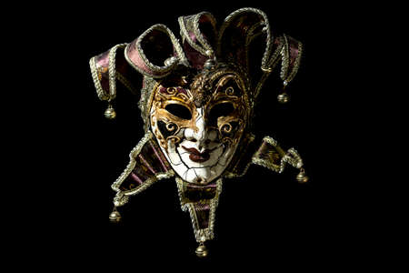 Beautiful venetian souvenir mask on black backgroundの写真素材