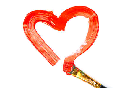 Heart Shape made of red paint with brush isolated on white background.