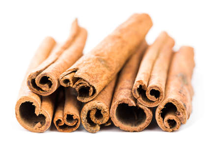 cinnamon sticks spice isolated on white background closeup