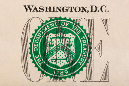 Stamp of the Department of The Treasury on US one dollar bill closeup macro.の写真素材