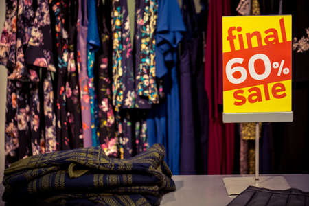 Sign in a clothing store with discount inscription SALE