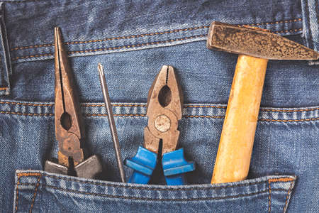 Working tools in jeans pocket. Close upの写真素材