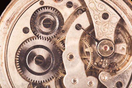 Close-up of old clock rusty mechanism with gears. Vintage tonedの写真素材