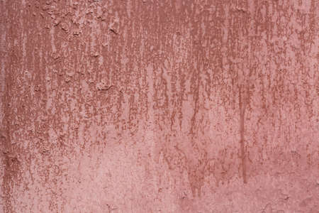 Red grungy painted metal background with rust