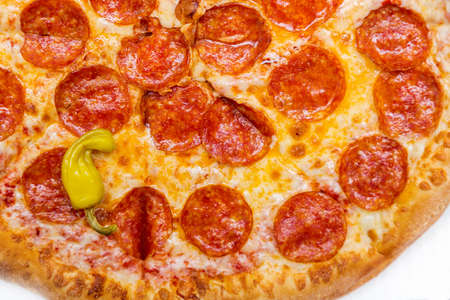 Tasty epperoni pizza with green pepper closeup. Top view.の写真素材