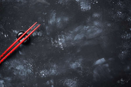 Sushi chopsticks on stone table. Top view with copy space.の写真素材