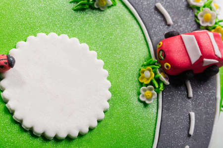 Delicious cake with ladybug and cars with free place for text close upの写真素材