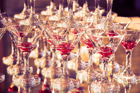 Abstract image with wine glasses and reflections in restaurant. Toned image.の写真素材