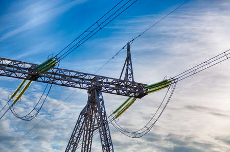 High voltage power pylon on nice blue sky with clouds.の写真素材