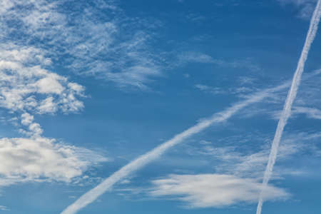 Blue sky with tiny clouds as a background.
