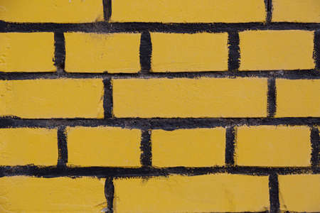 Background of yellow brick wall texture for designers