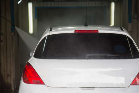 A white car wash with flowing water.の写真素材