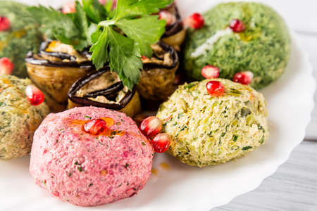 Spinach appetizer phali with pomegranate seeds close up. Georgian cuisine.の写真素材