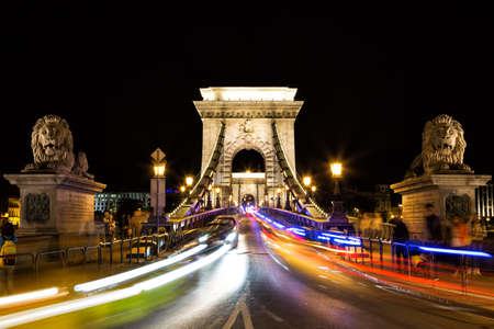Szechenyi Chain Bridge with colorful light trails by night in the city of Budapest, Hungary.の写真素材