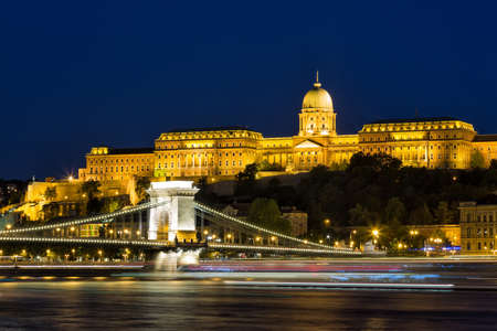 Budapest by night - Night view of the Szechenyi Chain Bridge, that spans the River Danube between Buda and Pest and Buda Castle.の写真素材