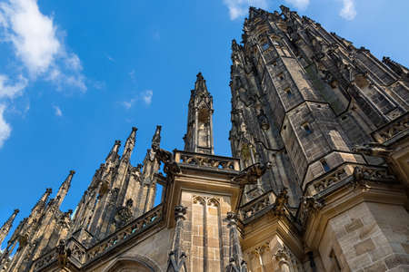 Closeup view on gothic cathedral of St. Vitus with blue sky in Prague Castle, Prague, Czech Republic.の写真素材
