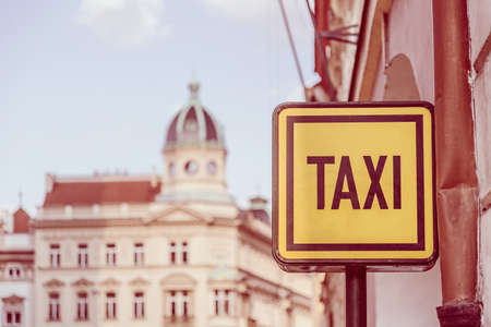 Taxi sign on the street in Prague. Tourism and travel concept. Toned selective focus image.の写真素材